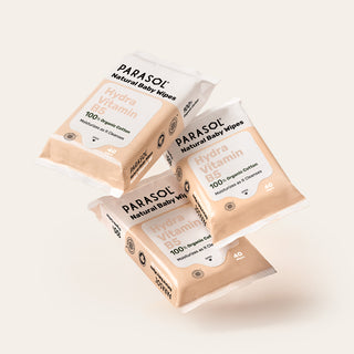 Three boxes of Parasol Natural Baby Wipes on a light background
