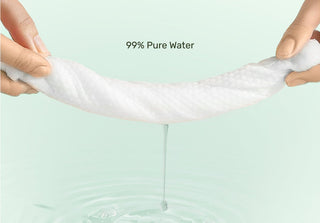 Person stretching a wipe with '99% Pure Water' text on a light green background
