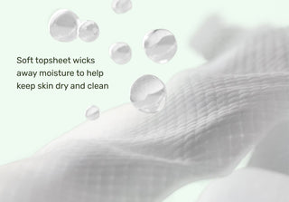 Text on a white background about a soft topsheet wicking away moisture.
